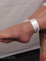 Blonde Milf in nylons tied at the ankles with white rope.